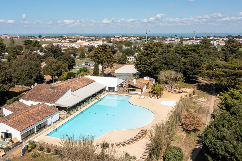 an aerial view of a swimming pool in a resort at Slow Village Ile de Ré in Saint-Martin-de-Ré