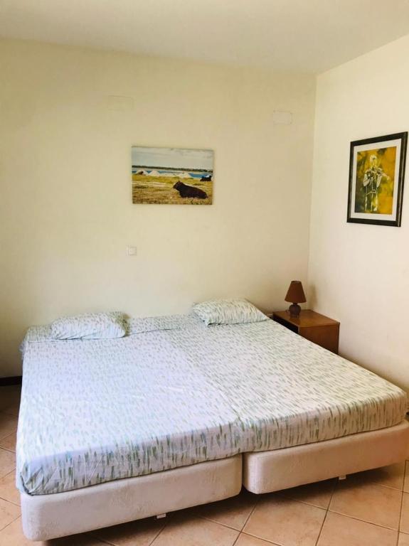 Postel nebo postele na pokoji v ubytování Residencial Lela d'Fermina