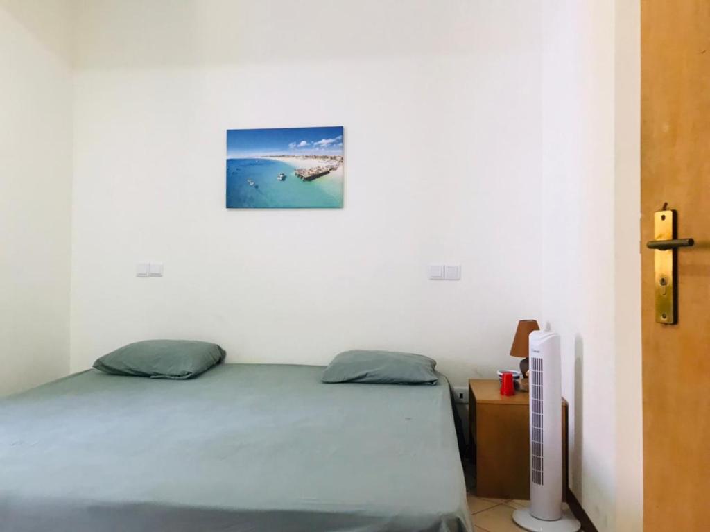 Postel nebo postele na pokoji v ubytování Residencial Lela d'Fermina