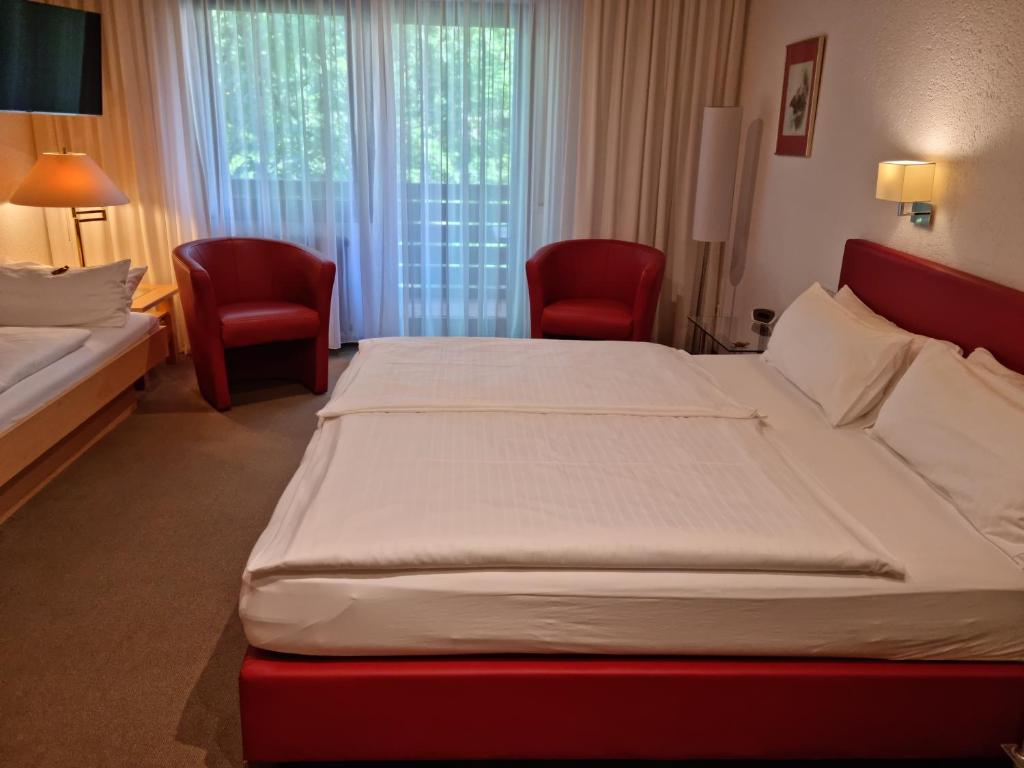Postel nebo postele na pokoji v ubytování Hotel Rebstock