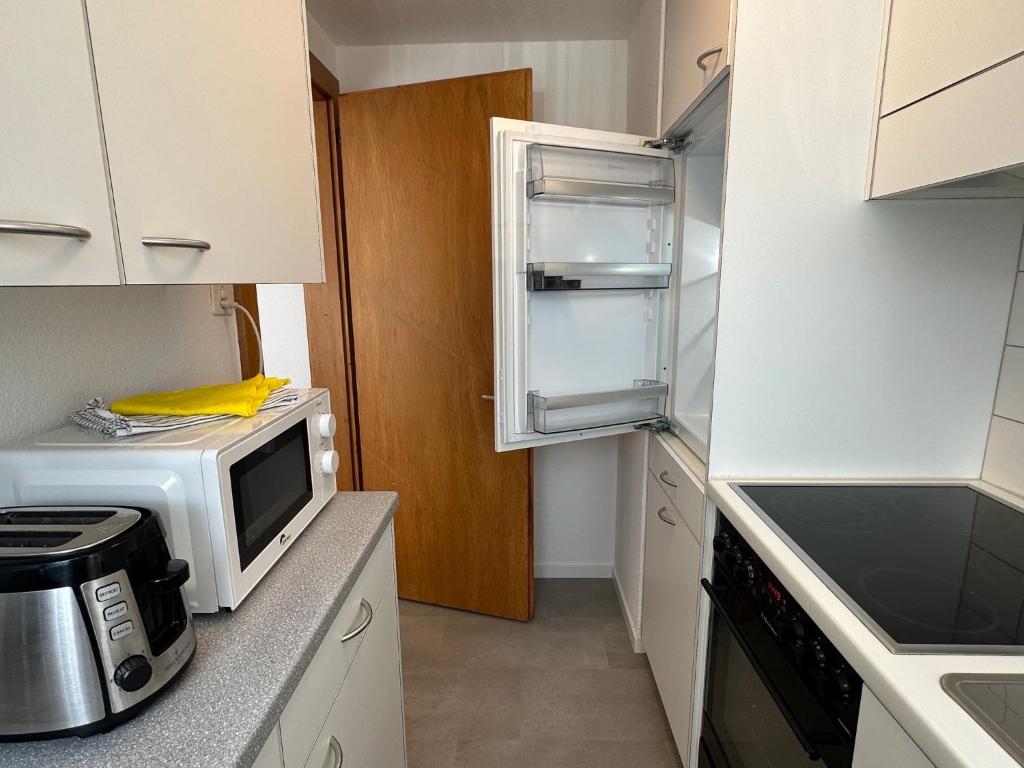 Kuchyň nebo kuchyňský kout v ubytování Alpina Appartment Kandersteg