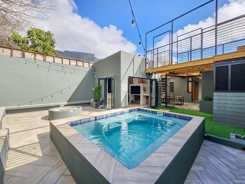 a swimming pool in the backyard of a house at Virginia Avenue Villas - Adriatica and Botanica in Cape Town