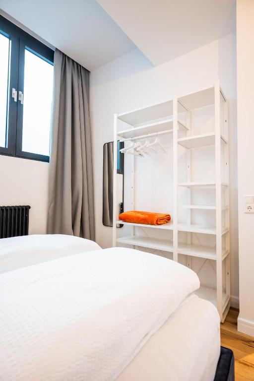 Posteľ alebo postele v izbe v ubytovaní Apartments Leopold Ferdinand