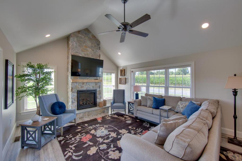 a living room with a couch and a fireplace at Patio and Yard Newly Built Retreat in Ronks! in Ronks