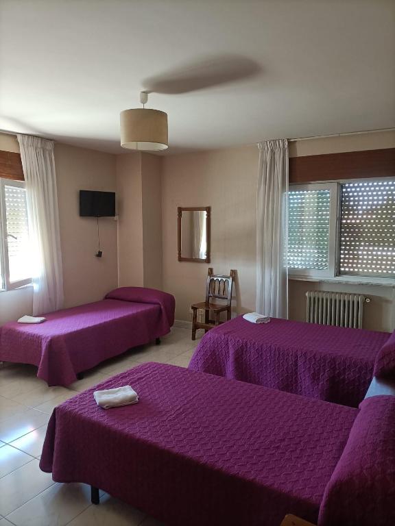 Postel nebo postele na pokoji v ubytování HOSTAL ALTO PÁRAMO