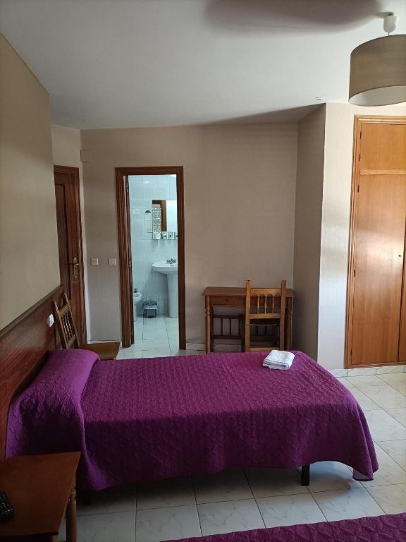 Postel nebo postele na pokoji v ubytování HOSTAL ALTO PÁRAMO