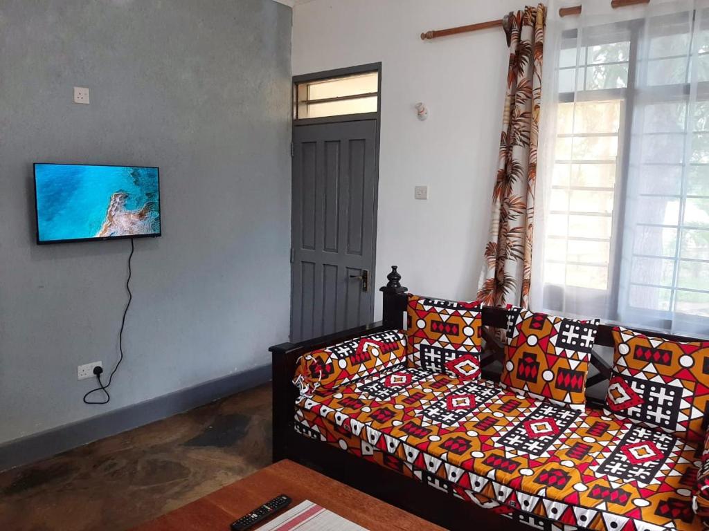 Postel nebo postele na pokoji v ubytování Cycad Palm Diani