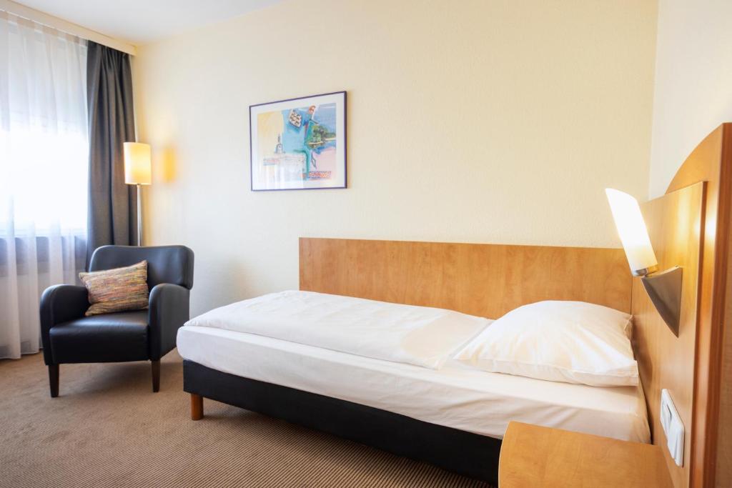 Postel nebo postele na pokoji v ubytování ACHAT Hotel Braunschweig