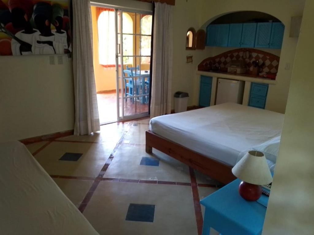 Una cama o camas en una habitación de Hotel - Residencial Madrugada