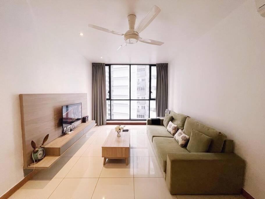 a living room with a couch and a tv at [PROMO]Connected train 2 Bedroom (ABOVE MALL)8 in Kuala Lumpur