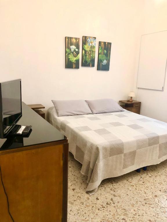 Postel nebo postele na pokoji v ubytování HOME TONINO