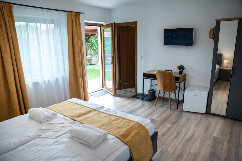 Postel nebo postele na pokoji v ubytování Magda Garden
