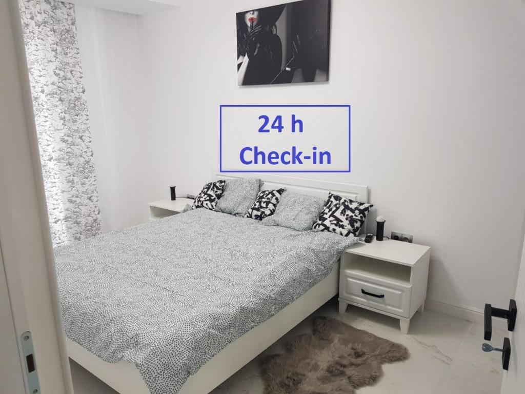 A bed or beds in a room at New Transilvania apartment