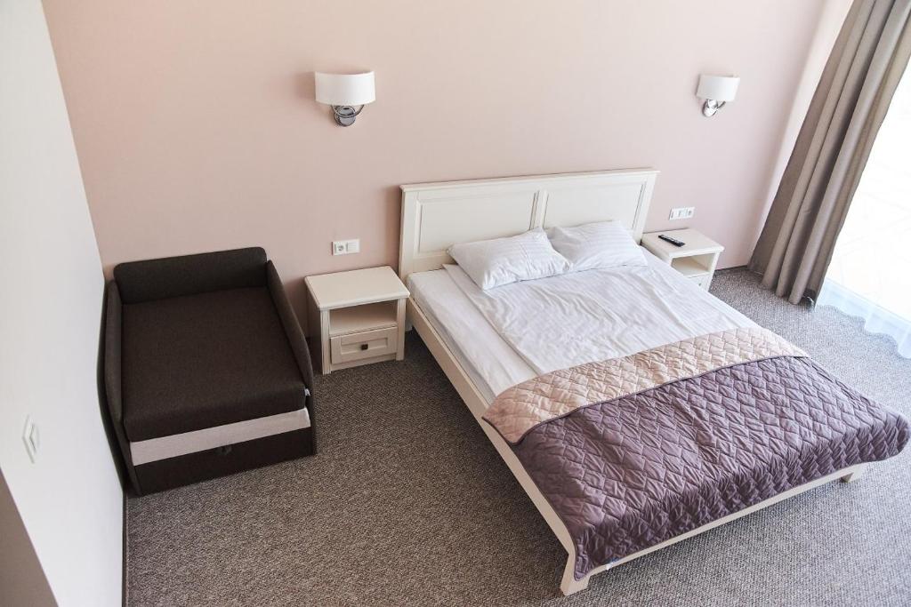 Postel nebo postele na pokoji v ubytování Вілла Край неба