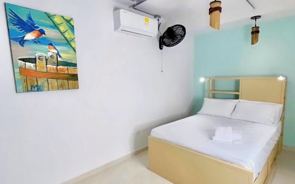 Postel nebo postele na pokoji v ubytování Hostal Las Guaduas