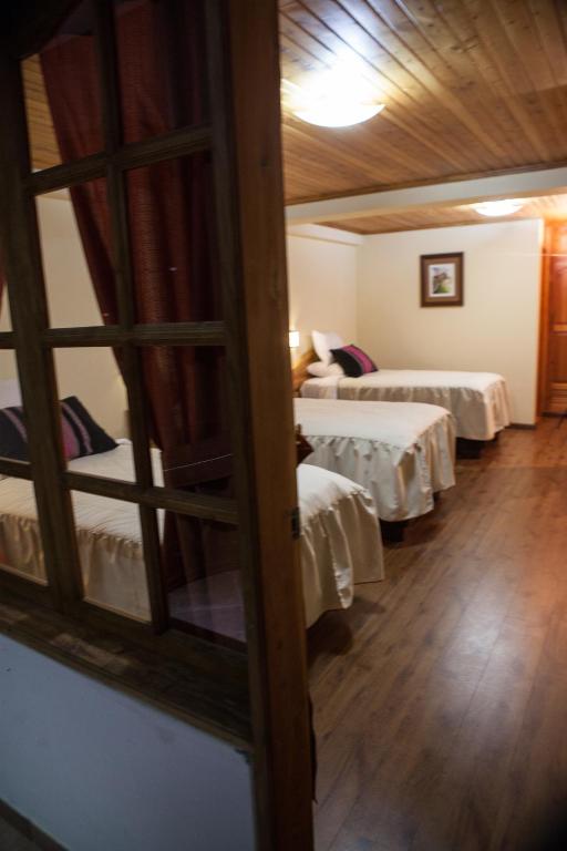 Postel nebo postele na pokoji v ubytování Maimara Hotel