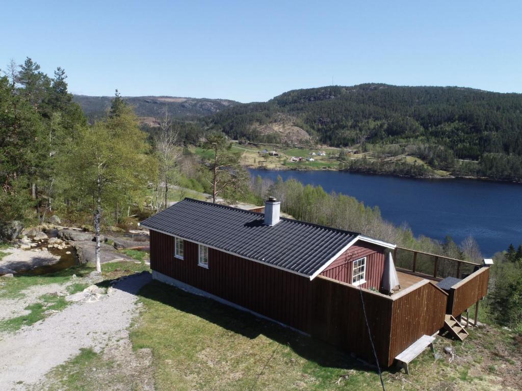 an aerial view of a cabin on a lake at Holiday Home Utsikt - SOW148 by Interhome in Fossdal