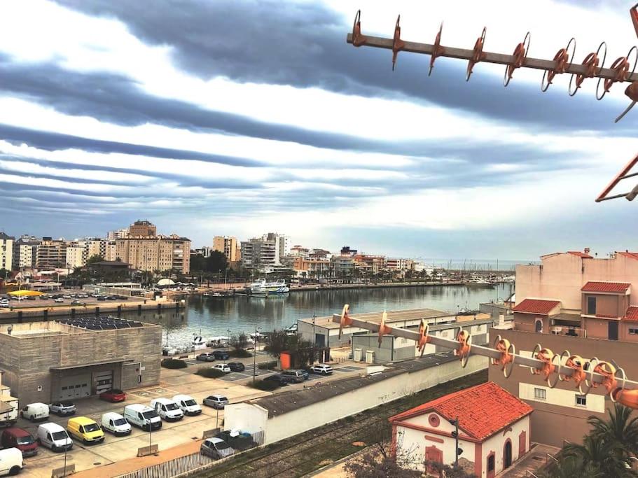 a view of a city with a river and buildings at Piso en Playa de Gandía! in Gandía