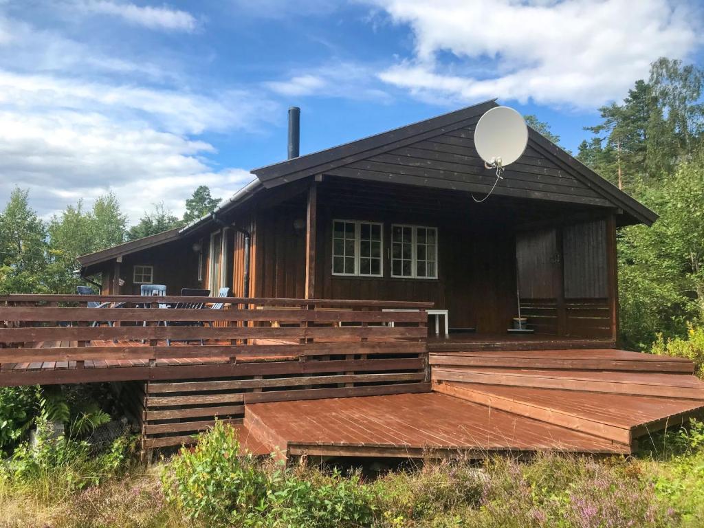a house with a balloon on the deck at Chalet Trefall - FJH520 by Interhome in Gausvik