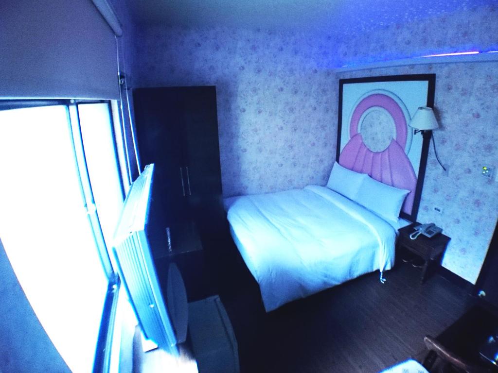 Postel nebo postele na pokoji v ubytování Fu Chia Hotel