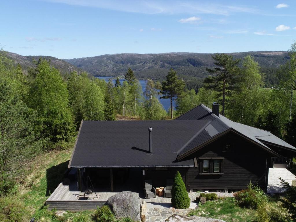an aerial view of a house with mountains in the background at Chalet Mariabu - SOW142 by Interhome in Fossdal