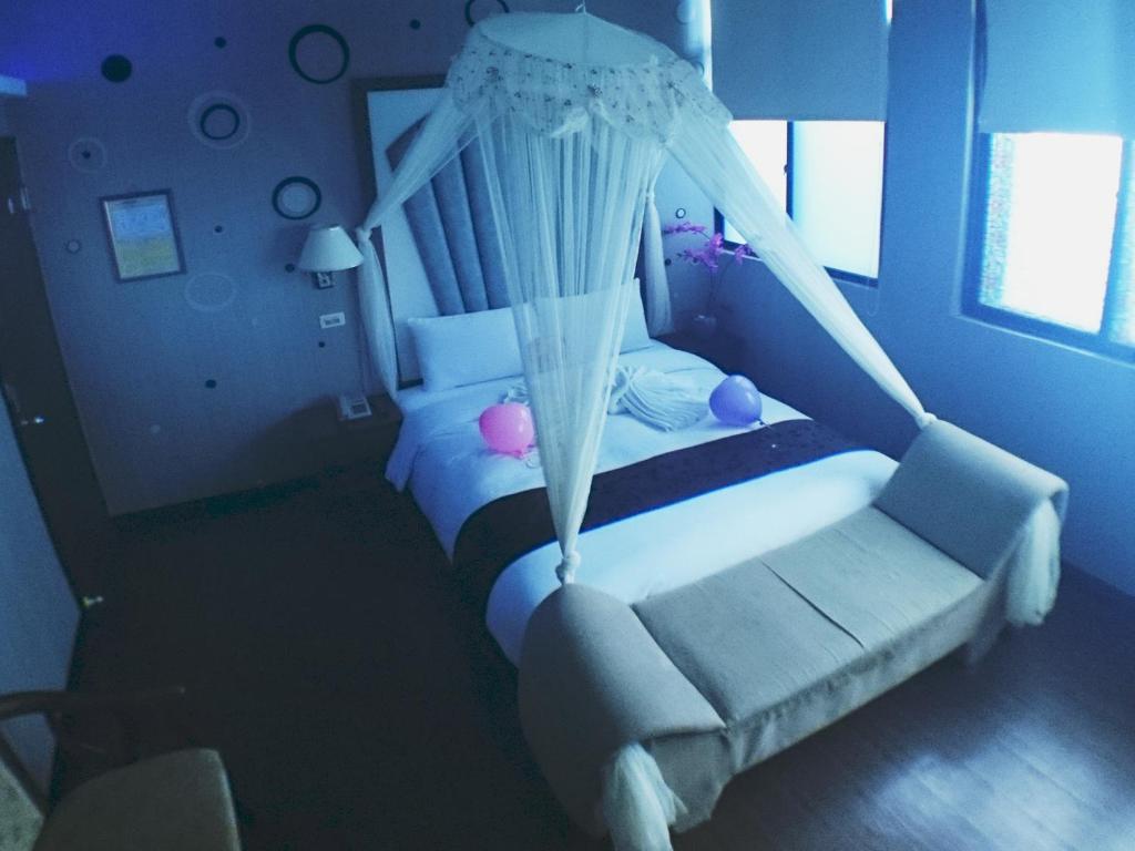 Postel nebo postele na pokoji v ubytování Fu Chia Hotel