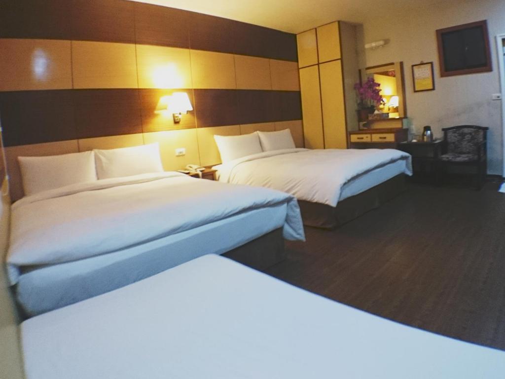 Postel nebo postele na pokoji v ubytování Fu Chia Hotel