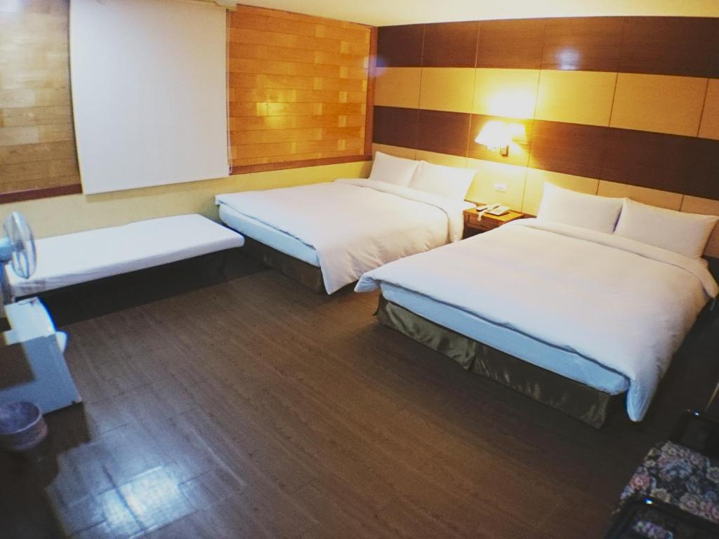 Postel nebo postele na pokoji v ubytování Fu Chia Hotel