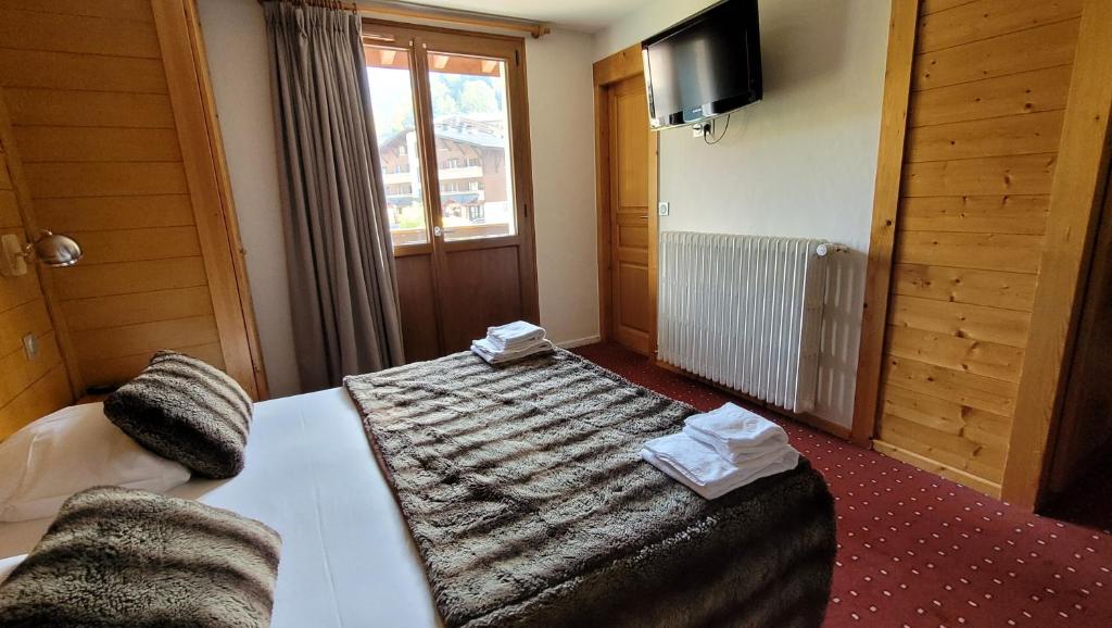 Postel nebo postele na pokoji v ubytování Hotel Christiania