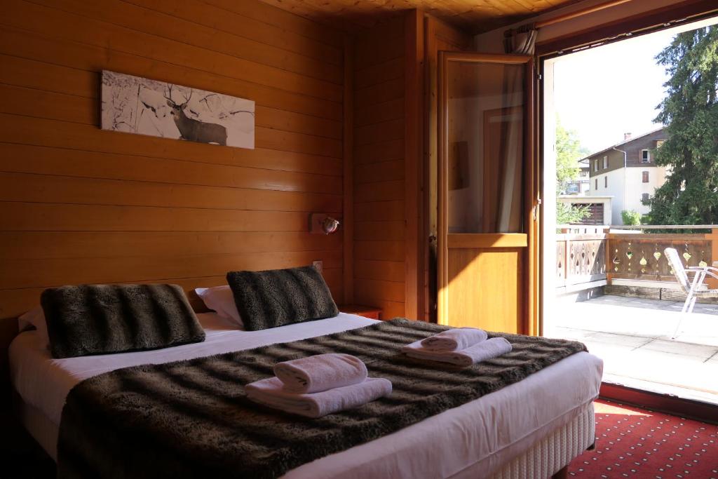 Postel nebo postele na pokoji v ubytování Hotel Christiania