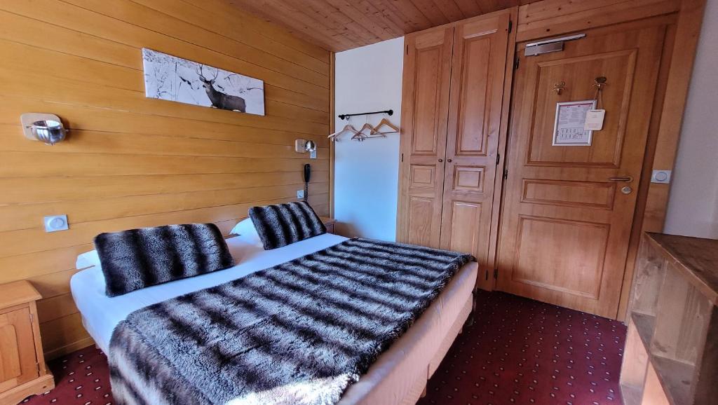 Postel nebo postele na pokoji v ubytování Hotel Christiania