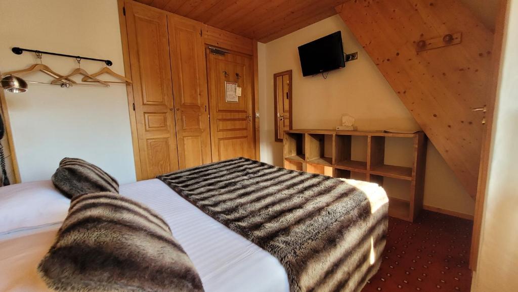 Postel nebo postele na pokoji v ubytování Hotel Christiania