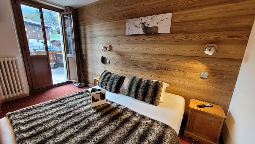 Postel nebo postele na pokoji v ubytování Hotel Christiania