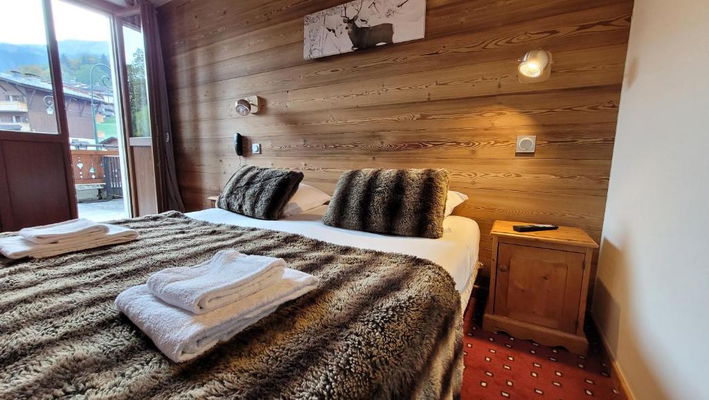 Postel nebo postele na pokoji v ubytování Hotel Christiania