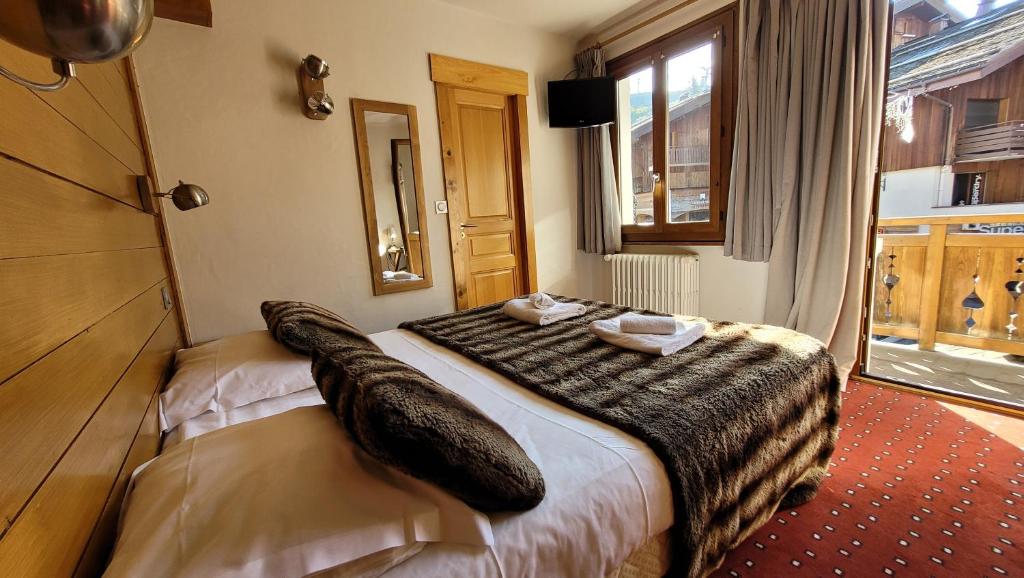 Postel nebo postele na pokoji v ubytování Hotel Christiania