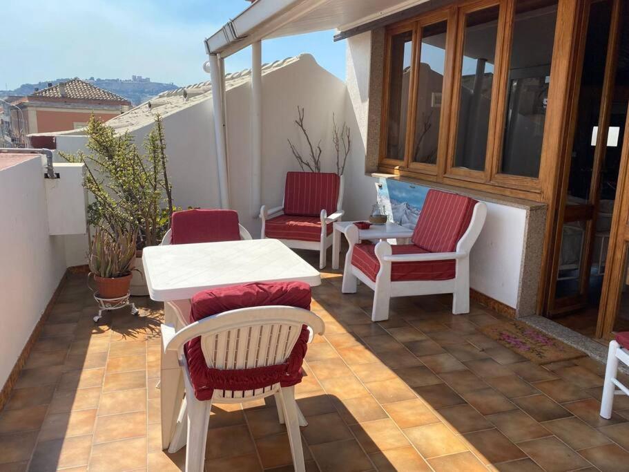 a patio with chairs and a table on a balcony at "Domus Cannas"-Casa Indipendente- in Cagliari