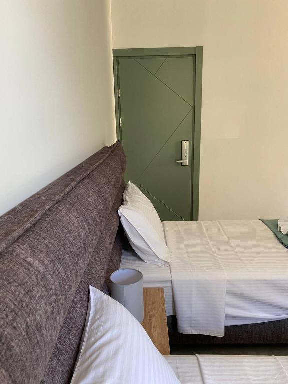 Postel nebo postele na pokoji v ubytování H2O