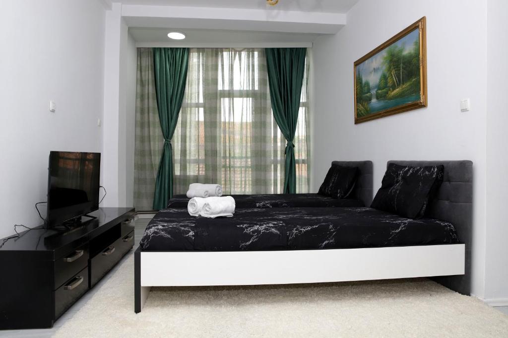 Postel nebo postele na pokoji v ubytování Hotel Xhema