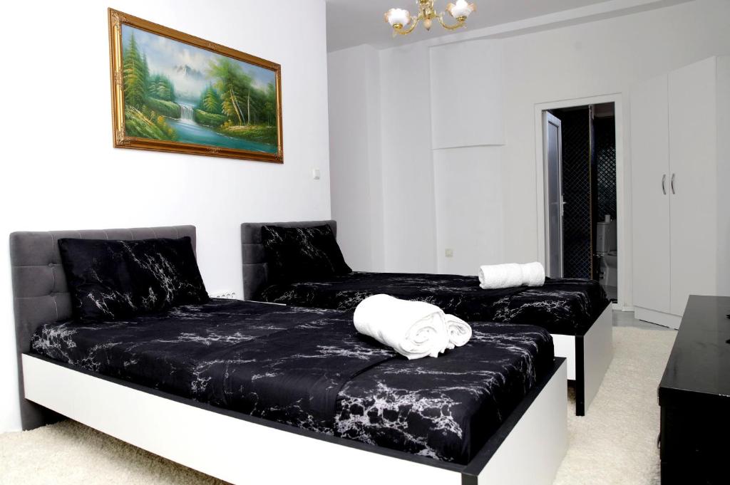 Postel nebo postele na pokoji v ubytování Hotel Xhema