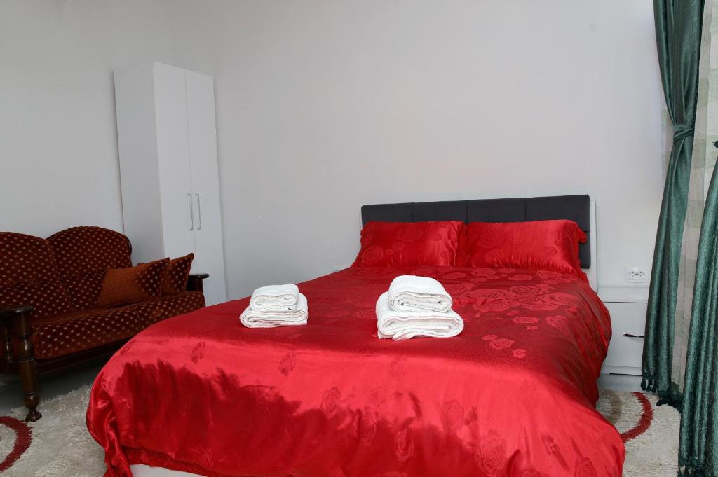 Postel nebo postele na pokoji v ubytování Hotel Xhema
