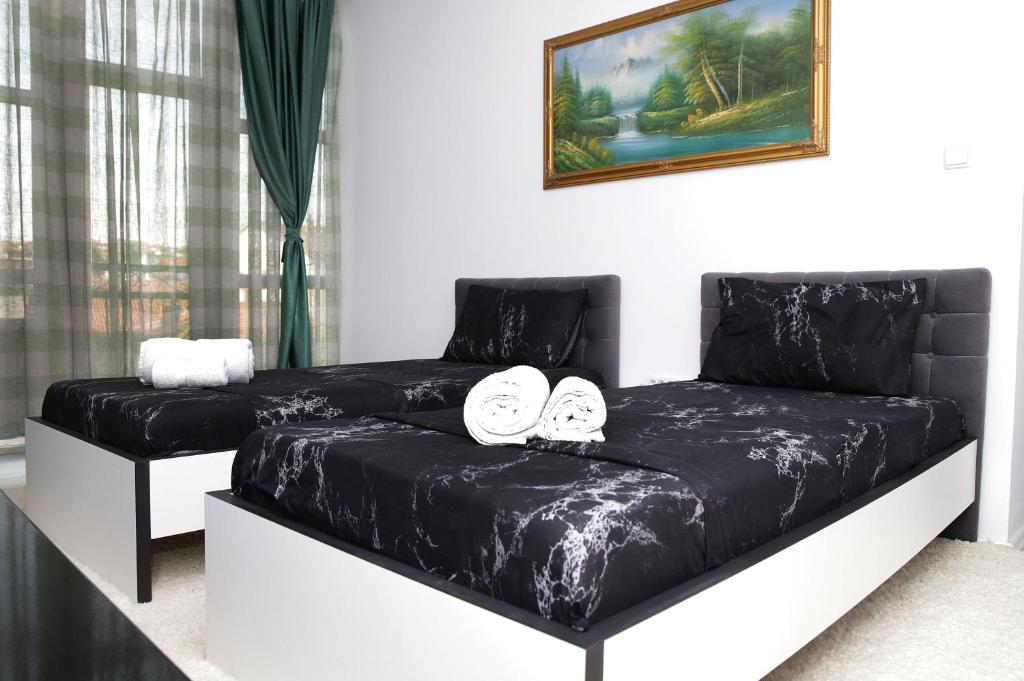 Postel nebo postele na pokoji v ubytování Hotel Xhema