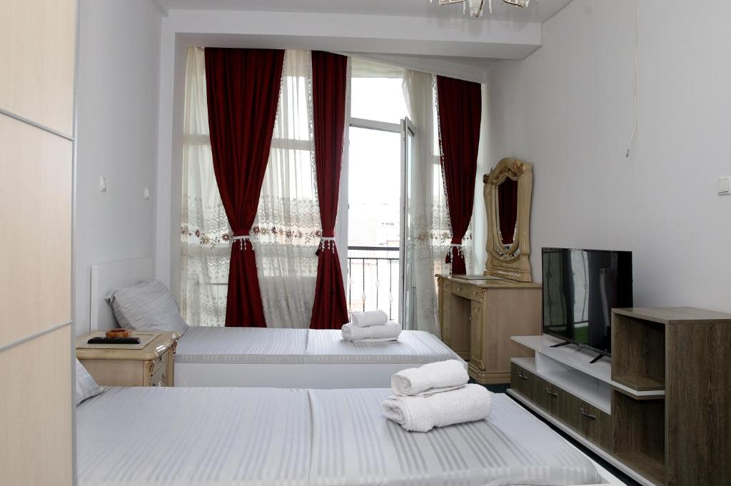Postel nebo postele na pokoji v ubytování Hotel Xhema