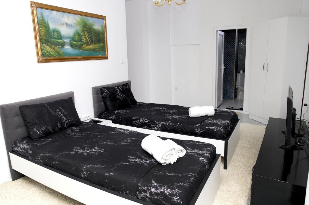 Postel nebo postele na pokoji v ubytování Hotel Xhema