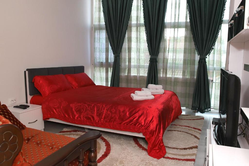 Postel nebo postele na pokoji v ubytování Hotel Xhema