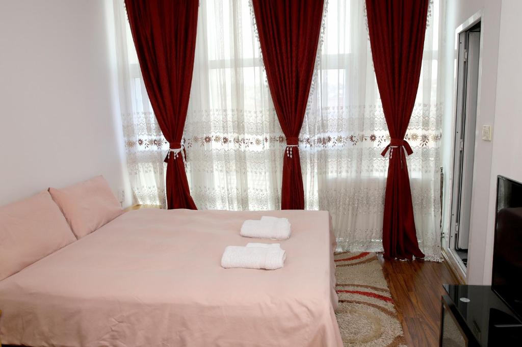 Postel nebo postele na pokoji v ubytování Hotel Xhema