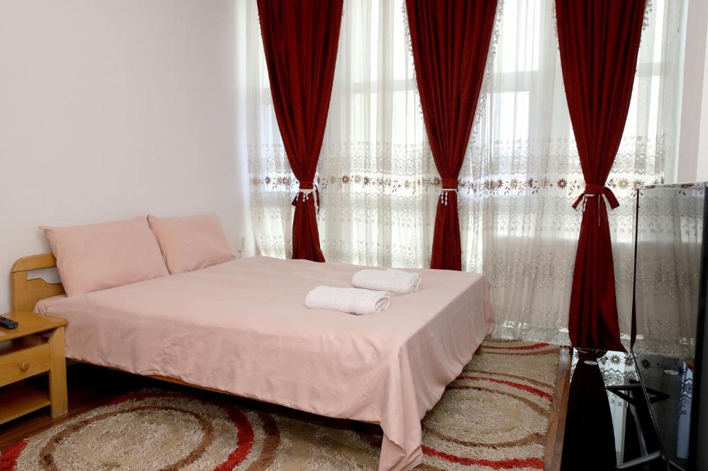 Postel nebo postele na pokoji v ubytování Hotel Xhema