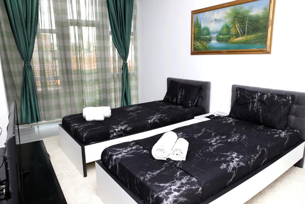 Postel nebo postele na pokoji v ubytování Hotel Xhema