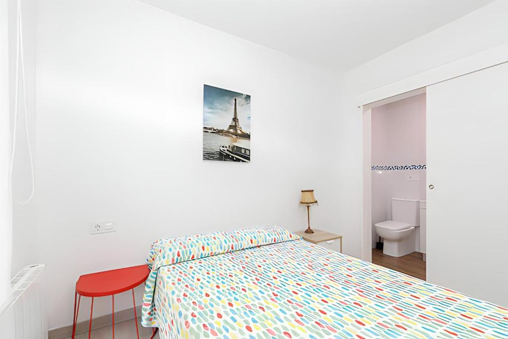 A bed or beds in a room at Piso Ría de Pontevedra