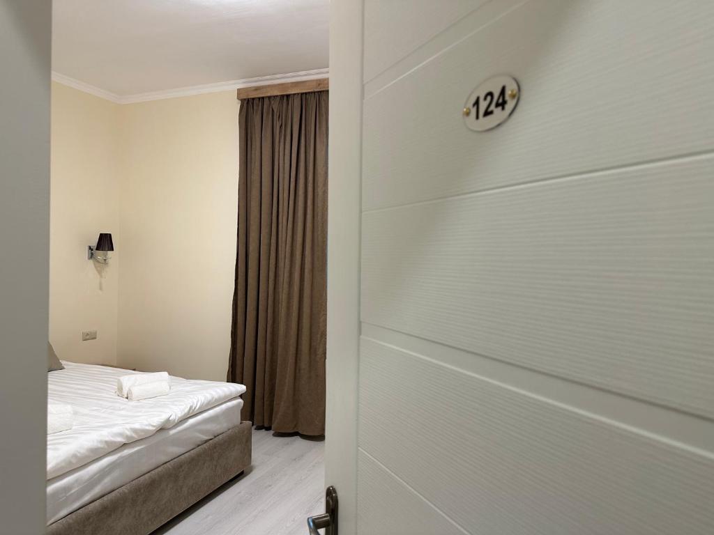 Postel nebo postele na pokoji v ubytování Hotel X