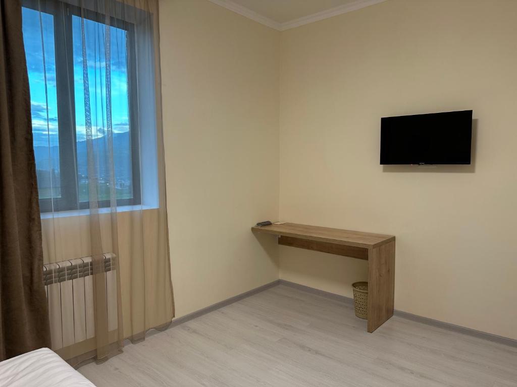 TV a/nebo společenská místnost v ubytování Hotel X